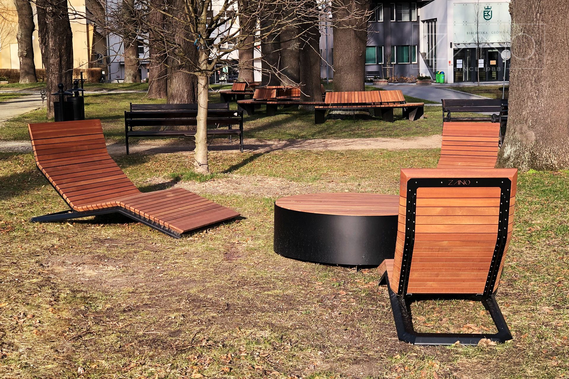 Urban space equipped with modern deck chairs and benches