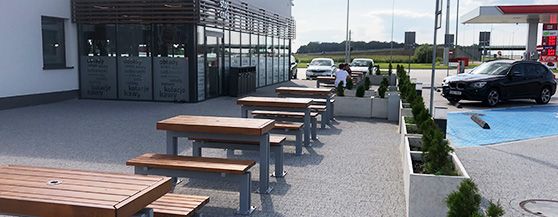 Gas station, benches with tables